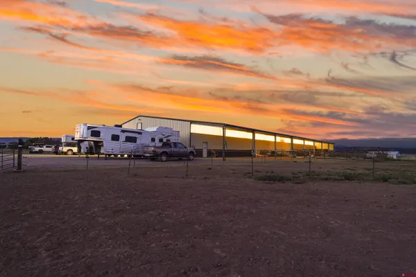 a view of a big house with a big yard