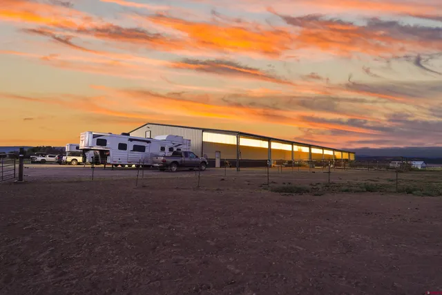 a view of a big house with a big yard