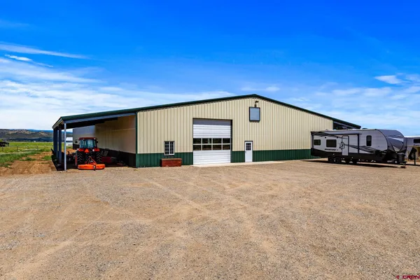 a view of a house with a big yard