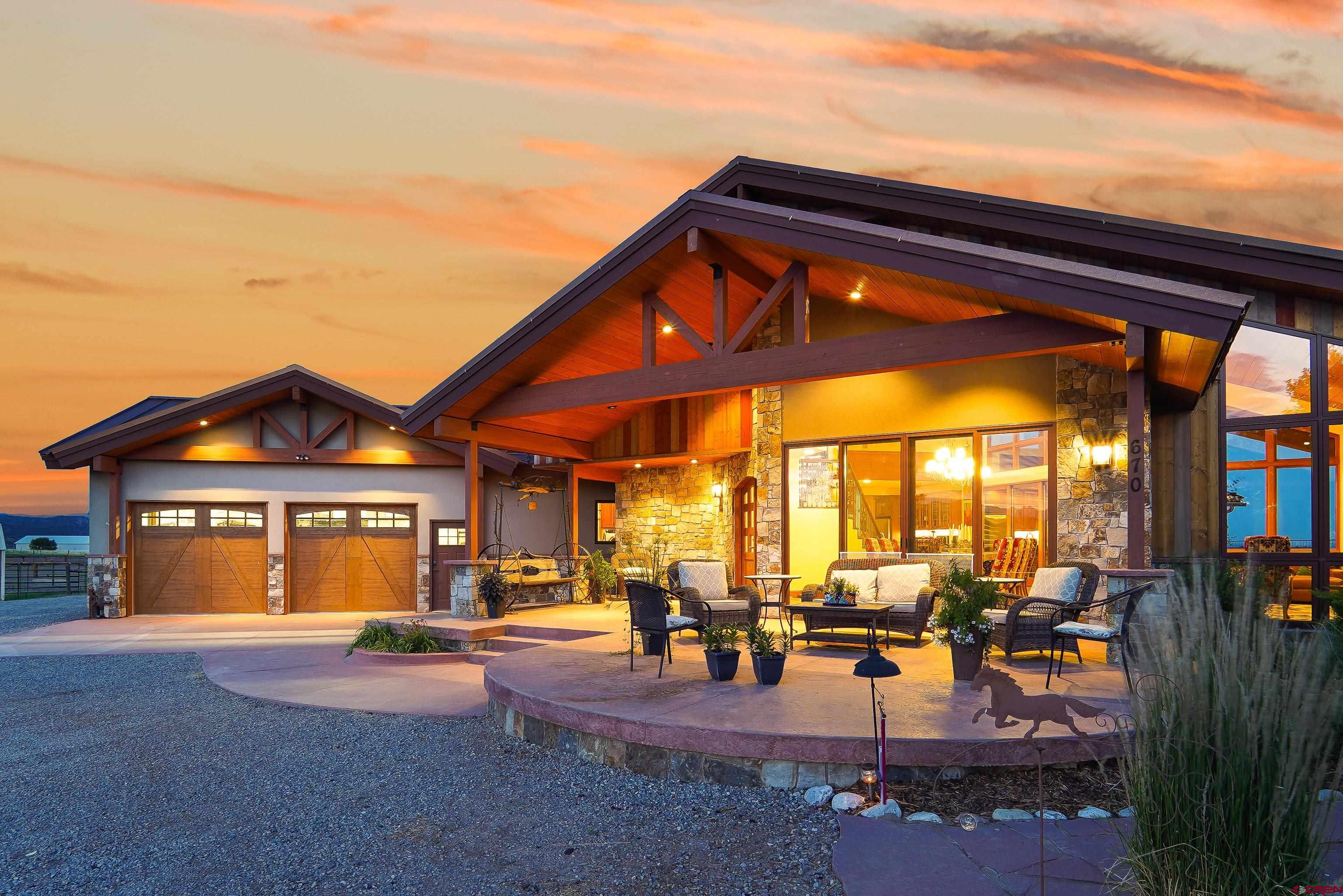 616 Cole Ranch Road Durango, CO 81303 - Photo 9 of 43 a front view of a house with a patio