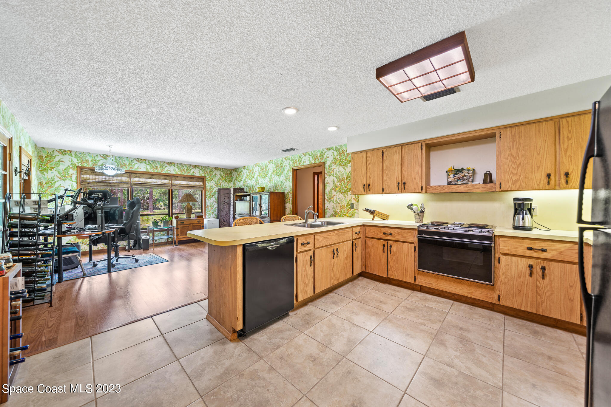 3836 Hield Road Northwest Palm Bay, FL 32907 - Photo 15 of 55 Kitchen Overlooking Keeping Room