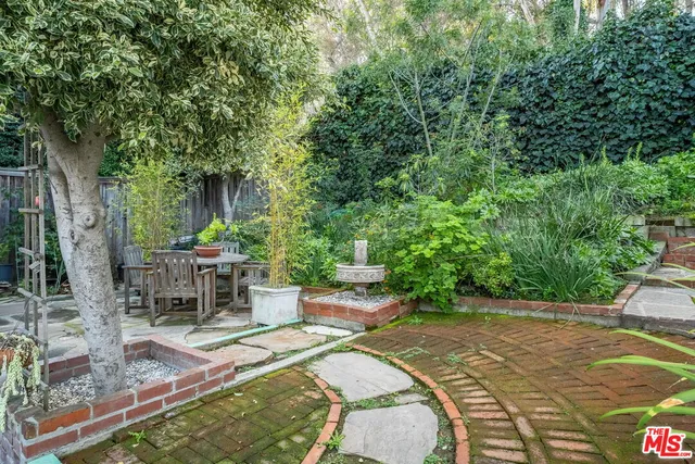 a view of a garden with a pathway