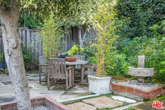 a view of a backyard with sitting area