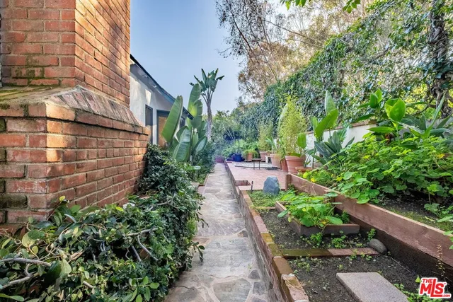 a front view of a house with a yard and a garage