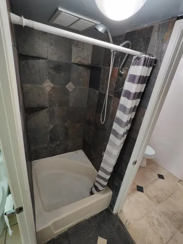 a view of balcony with wooden floor