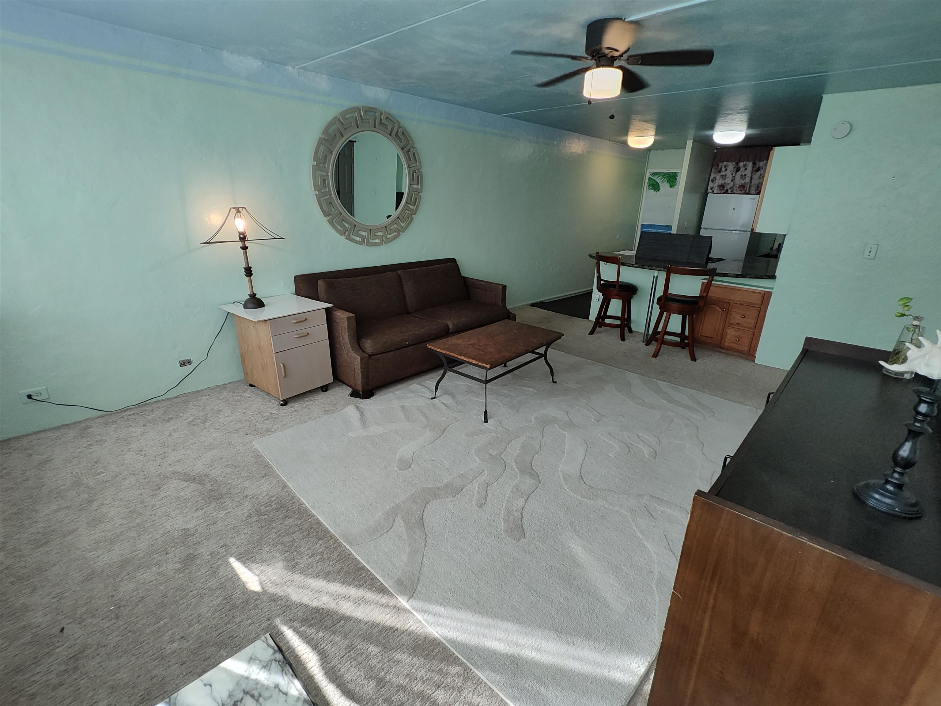 111 Kahului Beach Road, Unit C401 Kahului, HI 96732 - Photo 3 of 12 a living room with furniture and a window