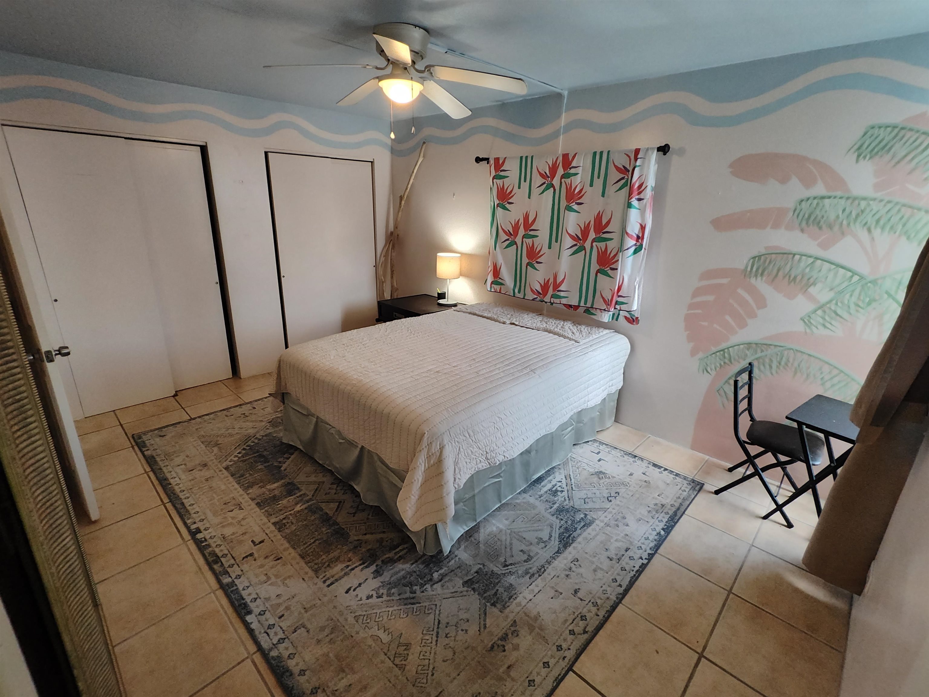 111 Kahului Beach Road, Unit C401 Kahului, HI 96732 - Photo 7 of 12 a living room with furniture and a flat screen tv