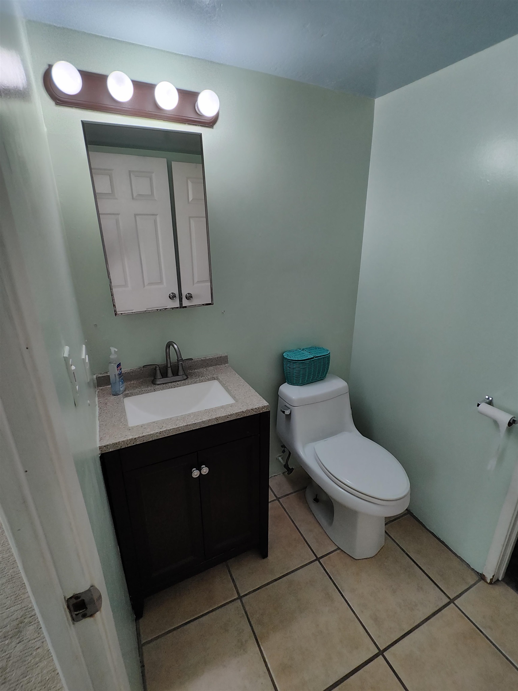 111 Kahului Beach Road, Unit C401 Kahului, HI 96732 - Photo 10 of 12 a bathroom with a toilet sink and mirror