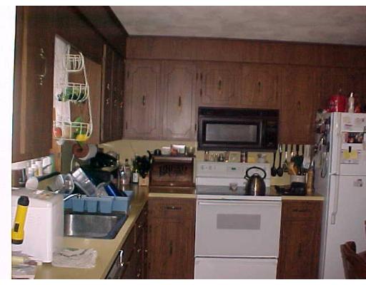 24 Thistle Road Woburn, MA 01801 - Photo 3 of 9 a kitchen with a sink and a stove top oven