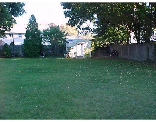 24 Thistle Road Woburn, MA 01801 - Photo 8 of 9 a view of a house with a garden