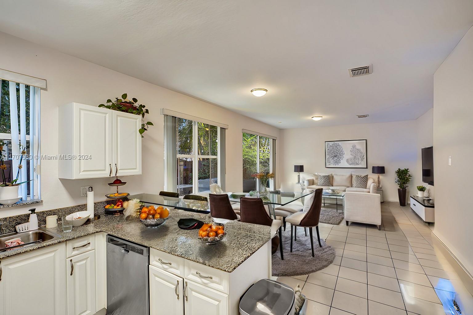 11763 Southwest 137th Path Miami, FL 33186 - Photo 16 of 27 a kitchen with a sink and cabinets