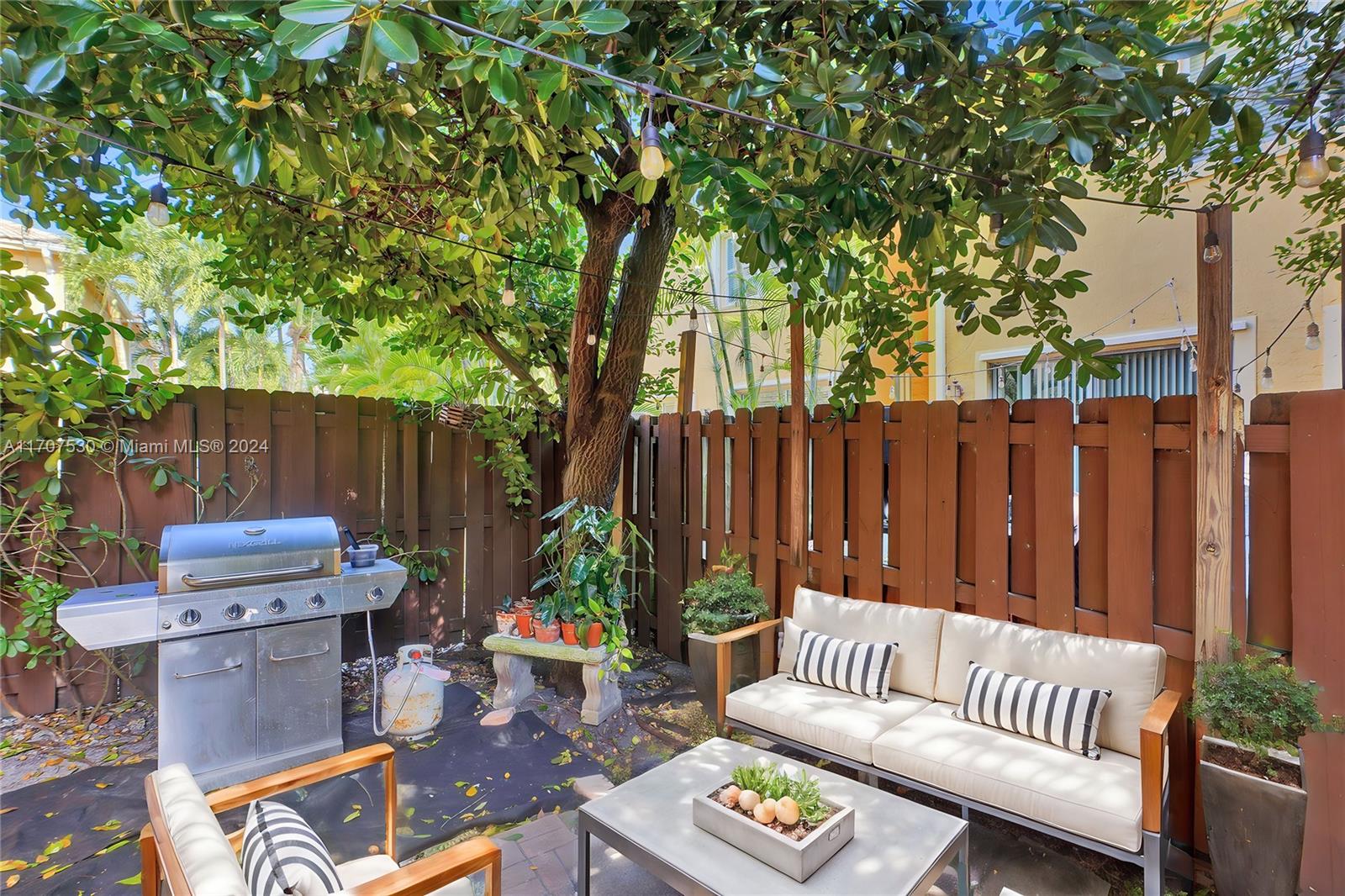 11763 Southwest 137th Path Miami, FL 33186 - Photo 24 of 27 a view of a patio with a chairs in a patio