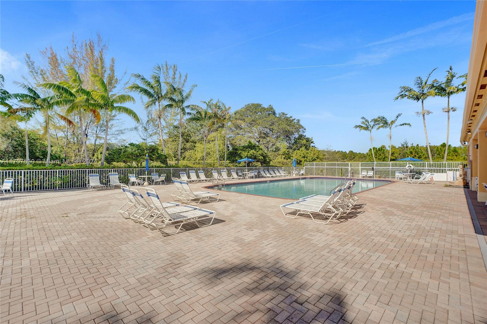 11763 Southwest 137th Path Miami, FL 33186 - Photo 25 of 27 a view of a swimming pool and a yard
