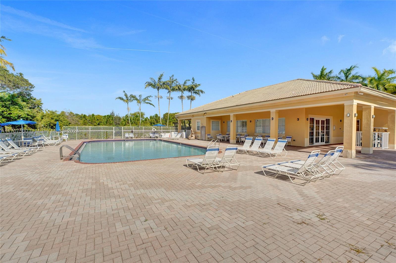 11763 Southwest 137th Path Miami, FL 33186 - Photo 26 of 27 a view of a house with pool porch and sitting area