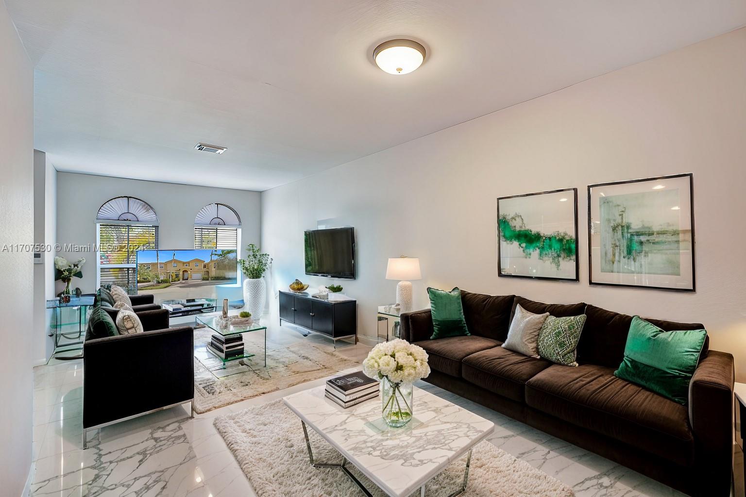 11763 Southwest 137th Path Miami, FL 33186 - Photo 3 of 27 a living room with furniture and a flat screen tv