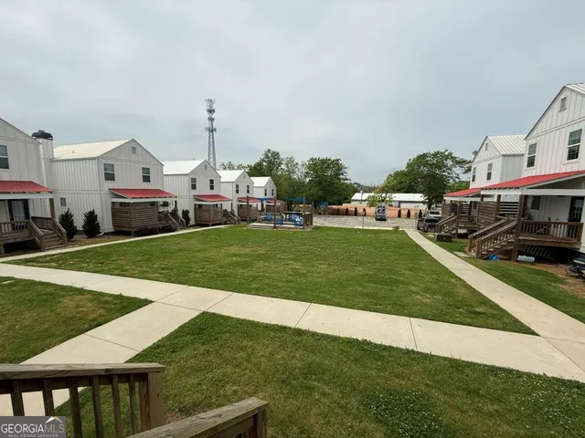 a view of a house with a big yard