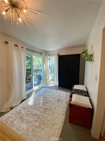 a bedroom with bed and window