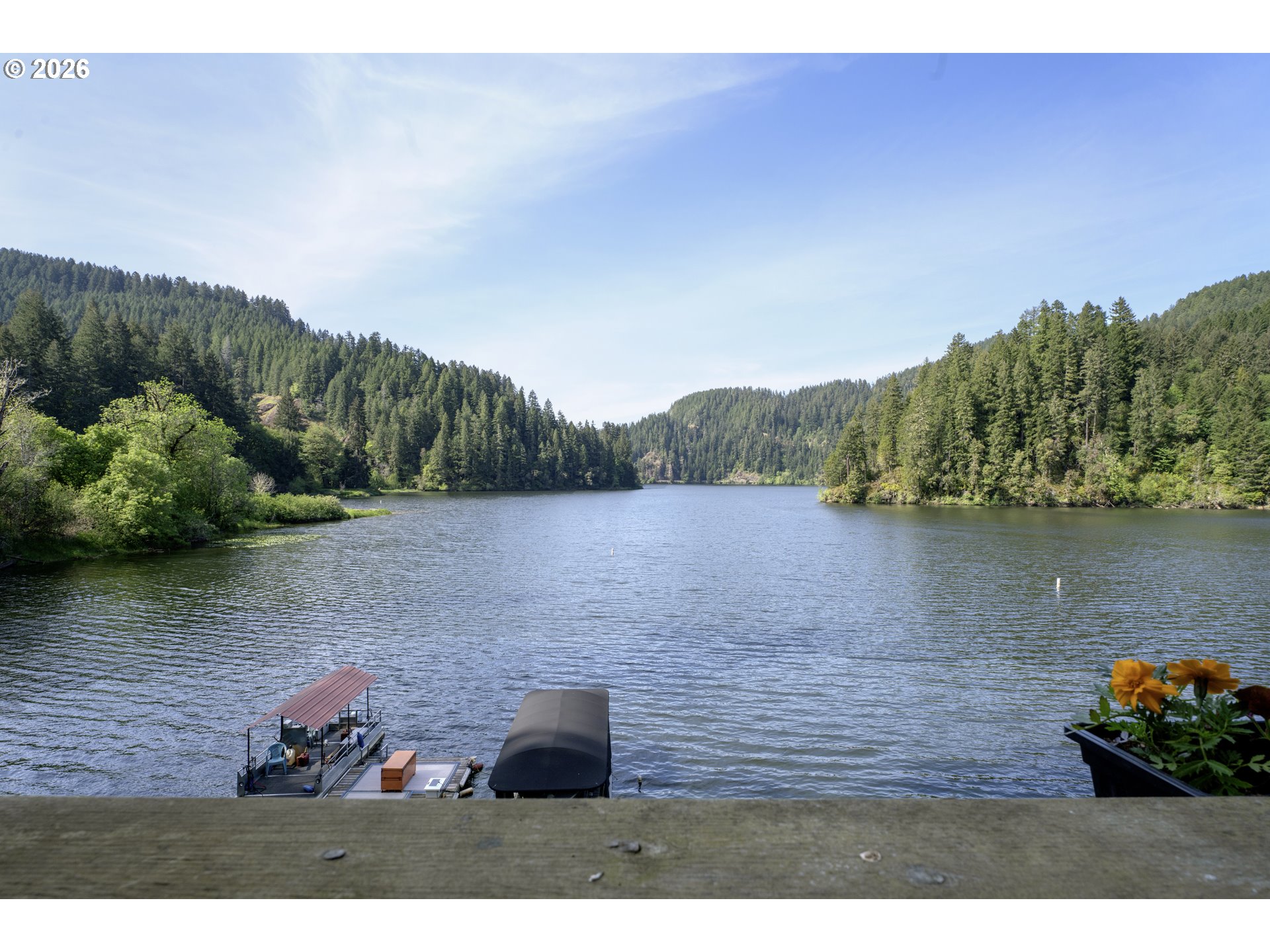 1901 Loon Lake Road Reedsport, OR 97467 - Photo 7 of 24 a view of a lake with a mountain in the background