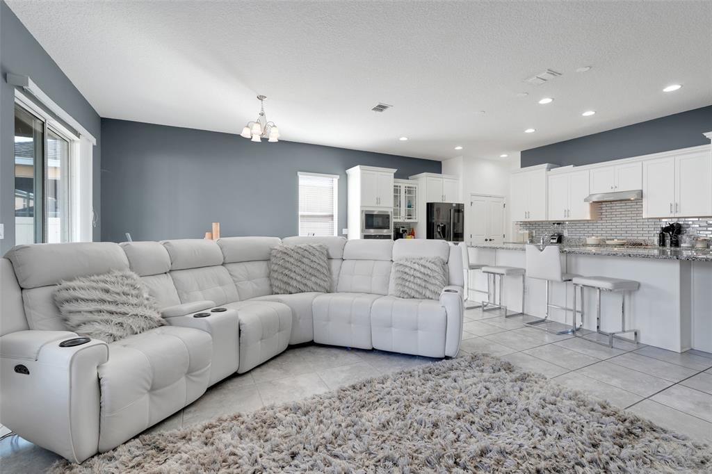 1807 Sunfish Street St. Cloud, FL 34771 - Photo 12 of 27 a living room with furniture and kitchen view