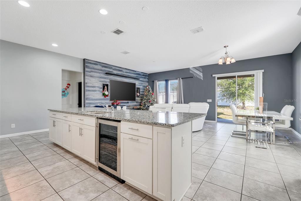 1807 Sunfish Street St. Cloud, FL 34771 - Photo 13 of 27 a kitchen with granite countertop a sink and a stove
