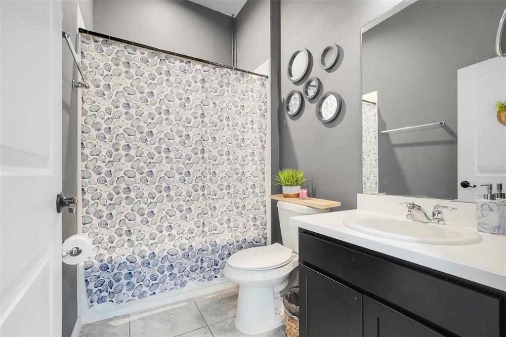 1807 Sunfish Street St. Cloud, FL 34771 - Photo 21 of 27 a bathroom with a sink toilet and shower