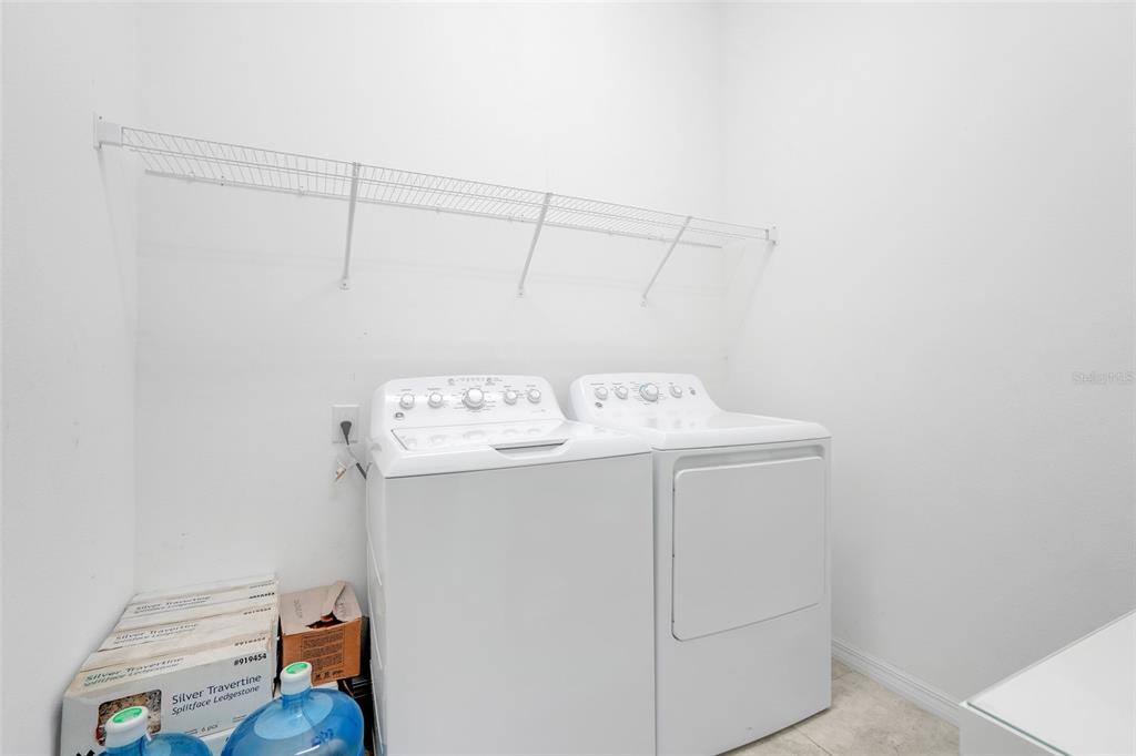 1807 Sunfish Street St. Cloud, FL 34771 - Photo 25 of 27 a utility room with dryer and washer