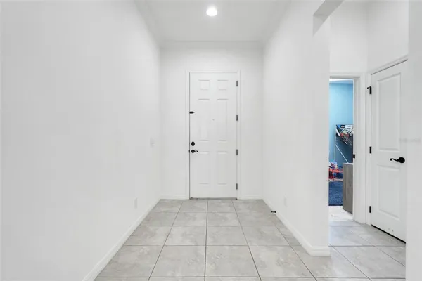 a large white kitchen with stainless steel appliances granite countertop a lot of counter space sink and cabinets