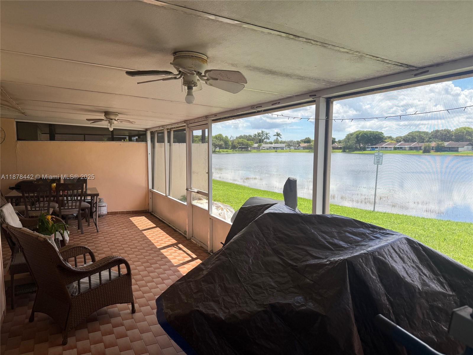 4929 Southwest 139th Court Miami, FL 33175 - Photo 18 of 27 a bed sitting in a bedroom next to a window
