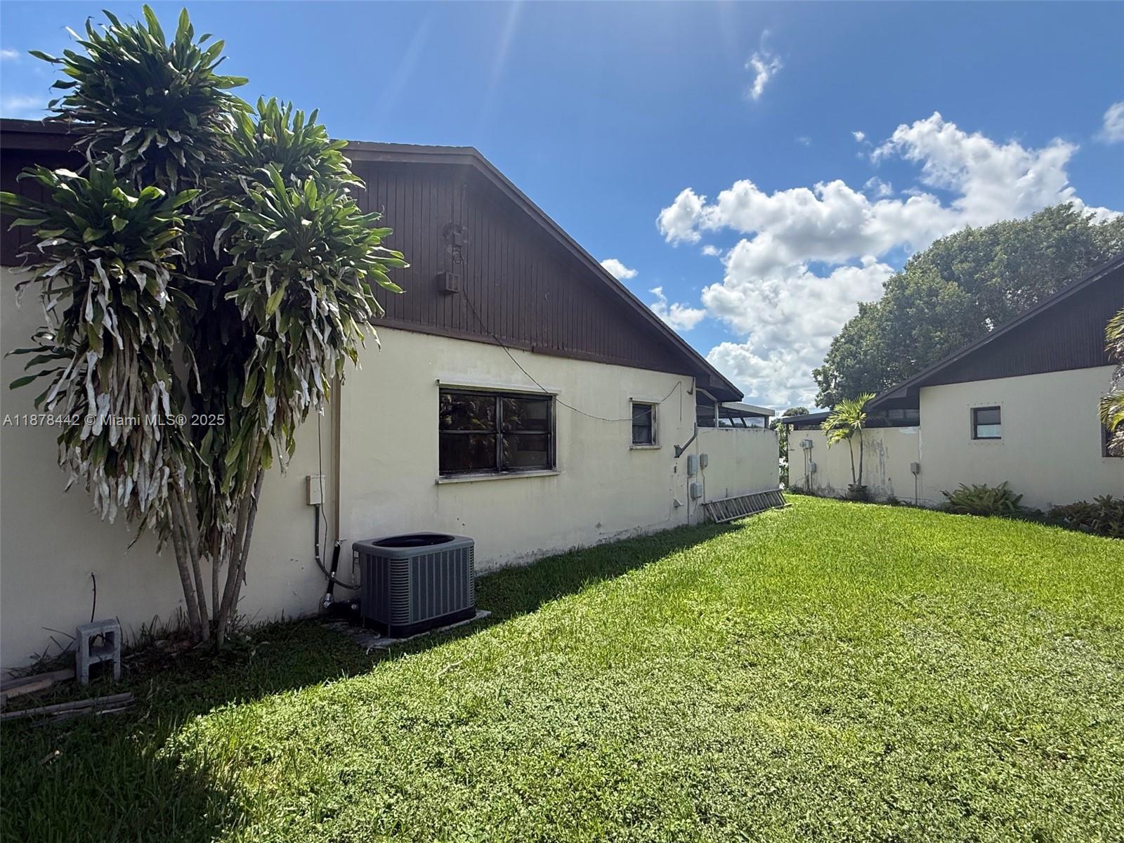 4929 Southwest 139th Court Miami, FL 33175 - Photo 25 of 27 a house view with a garden space