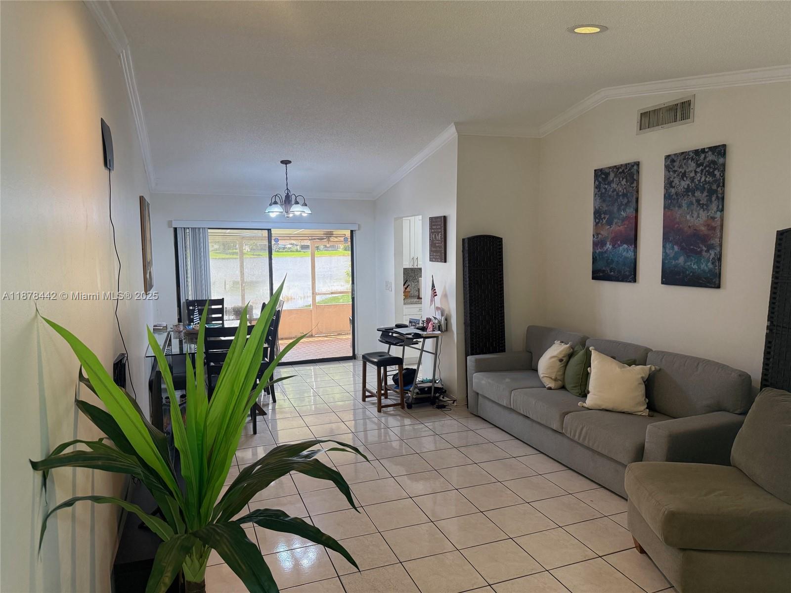 4929 Southwest 139th Court Miami, FL 33175 - Photo 5 of 27 a living room with furniture plant and a potted plant