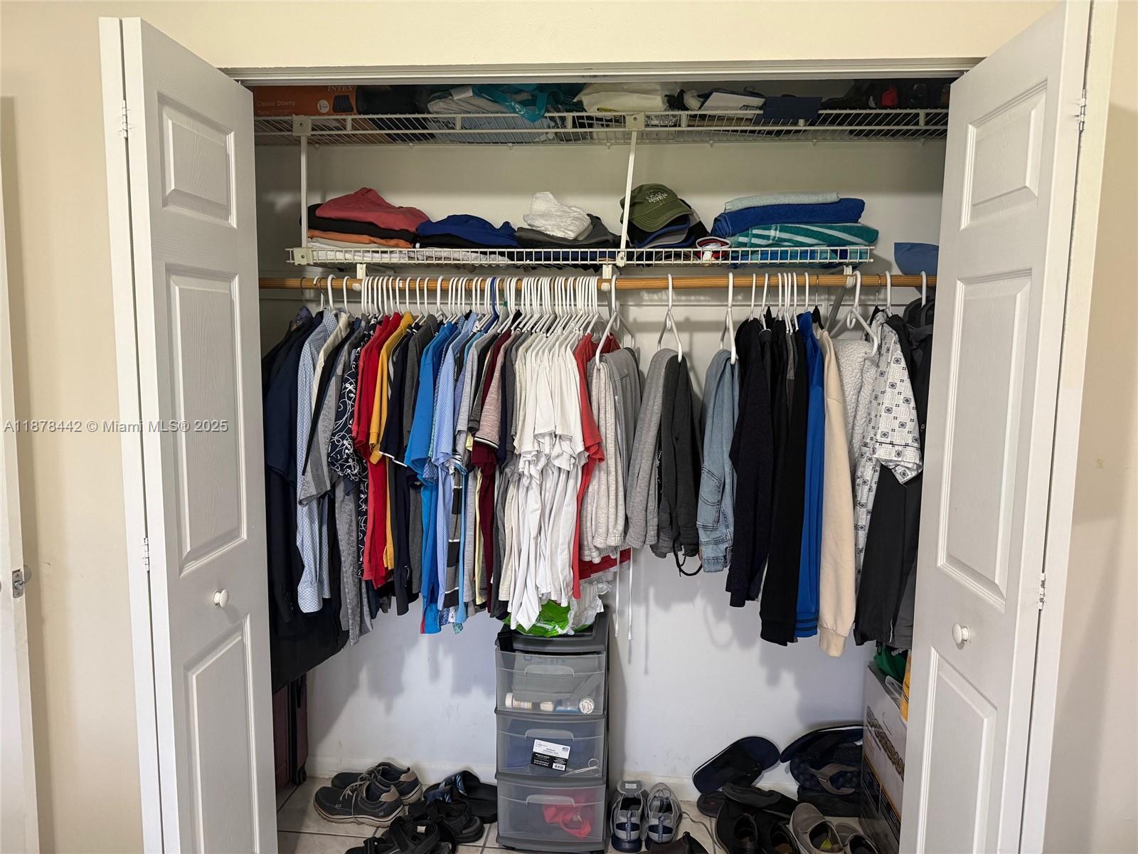 4929 Southwest 139th Court Miami, FL 33175 - Photo 8 of 27 a view of walk in closet with clothes and shoes