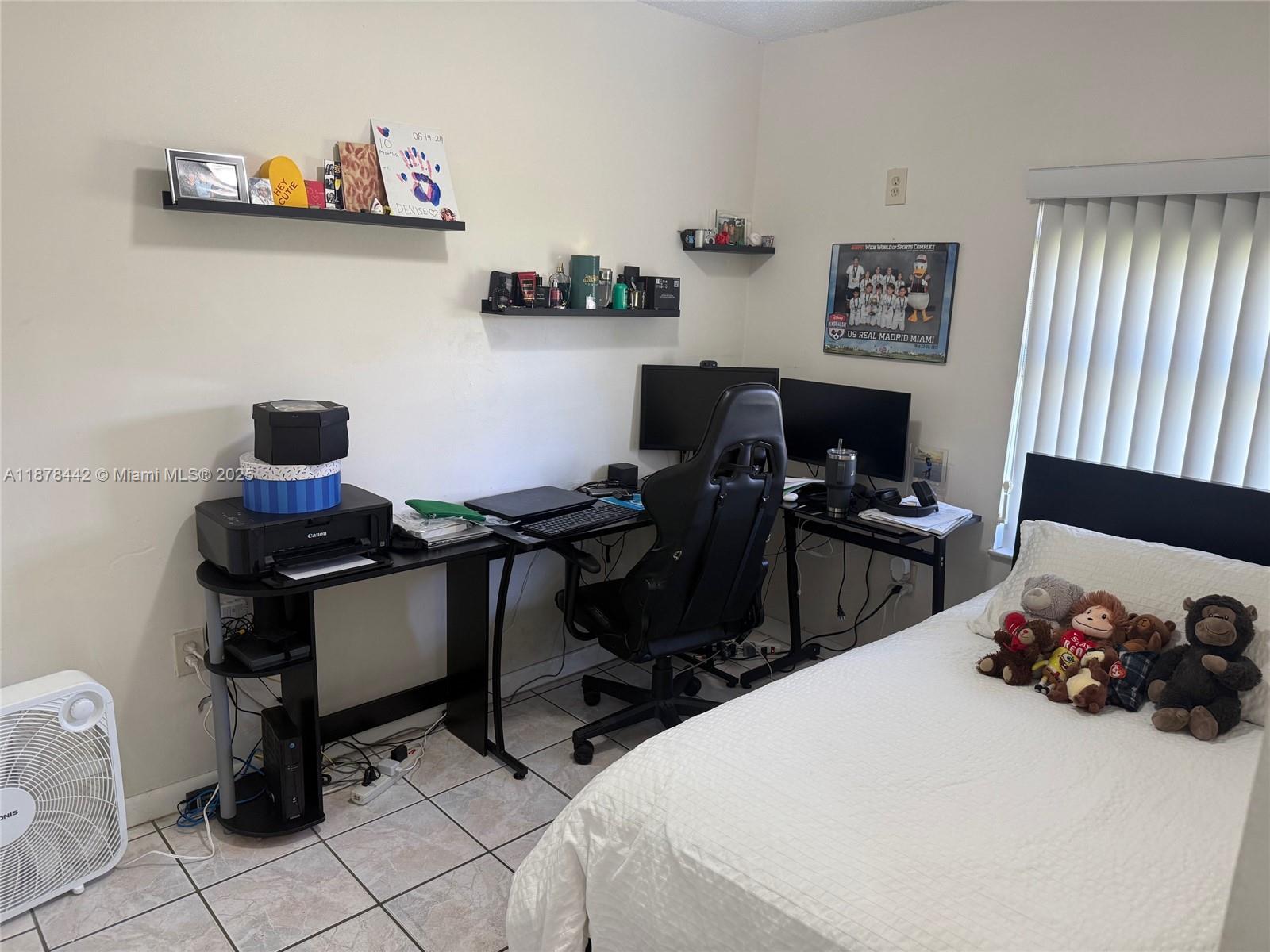 4929 Southwest 139th Court Miami, FL 33175 - Photo 10 of 27 a bed room with a bed and a chair