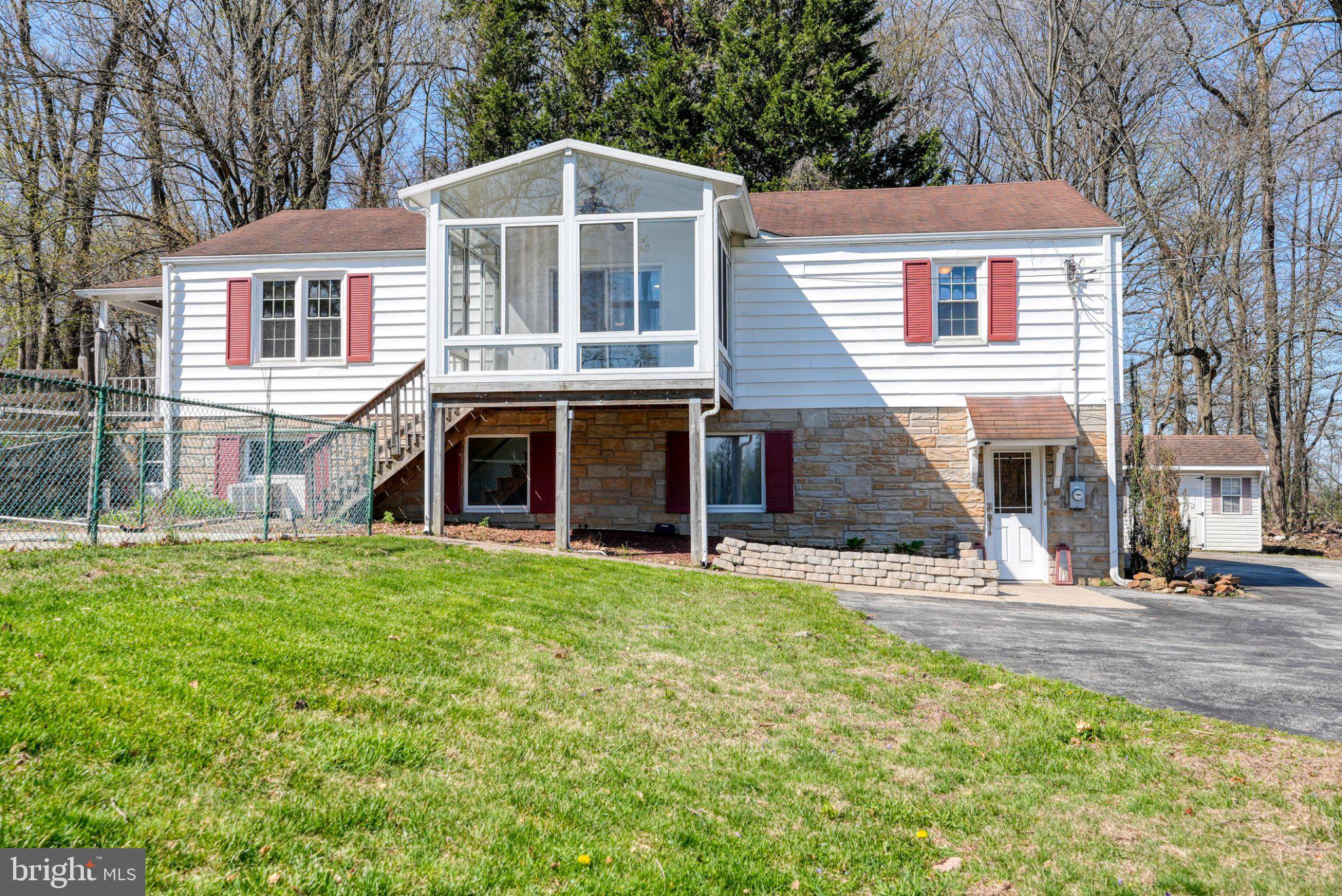 2512 Grandview Road Coatesville, PA 19320 - Photo 2 of 51 a front view of a house with a yard