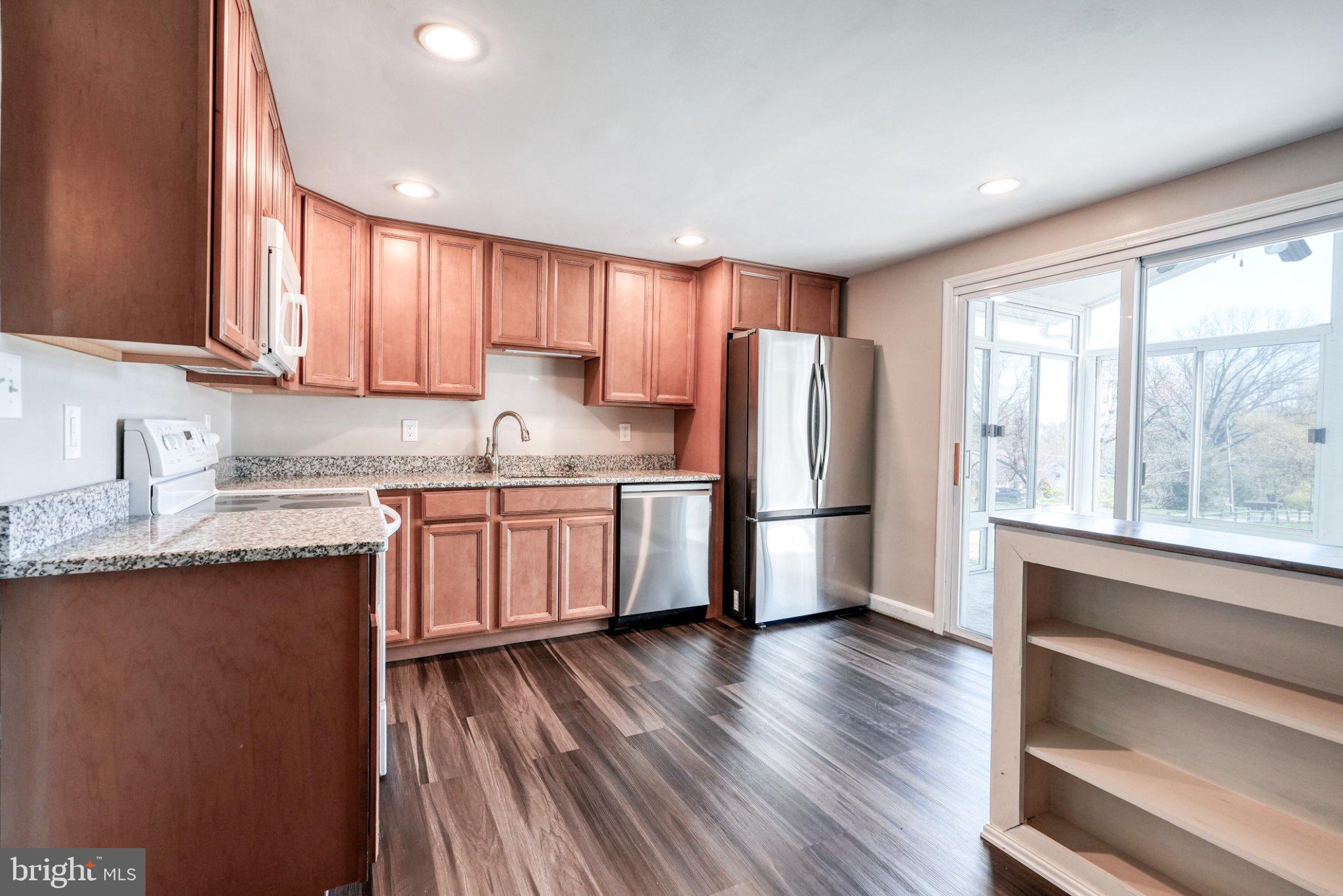 2512 Grandview Road Coatesville, PA 19320 - Photo 22 of 51 a kitchen with a refrigerator a sink and cabinets