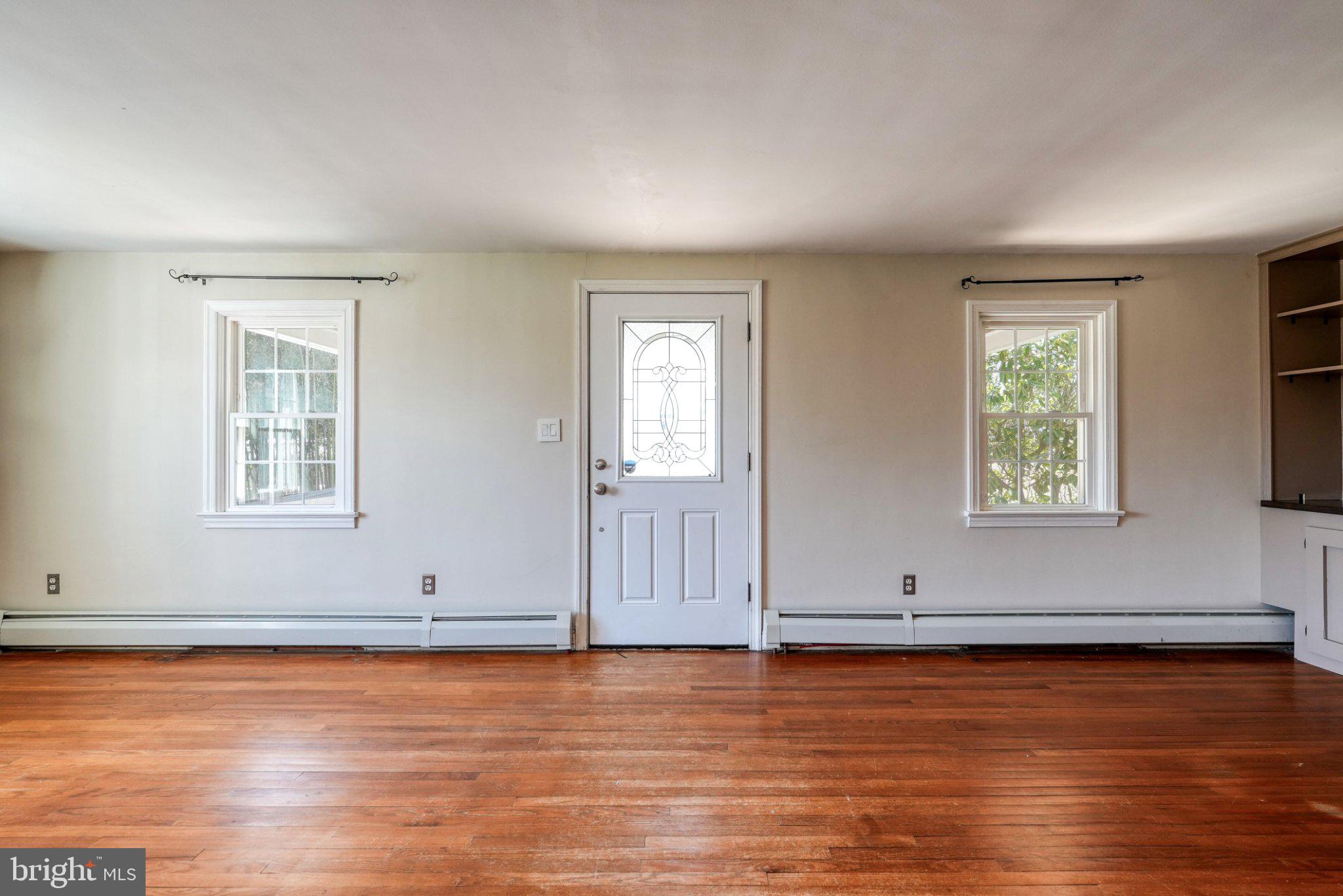 2512 Grandview Road Coatesville, PA 19320 - Photo 28 of 51 an empty room with wooden floor and windows