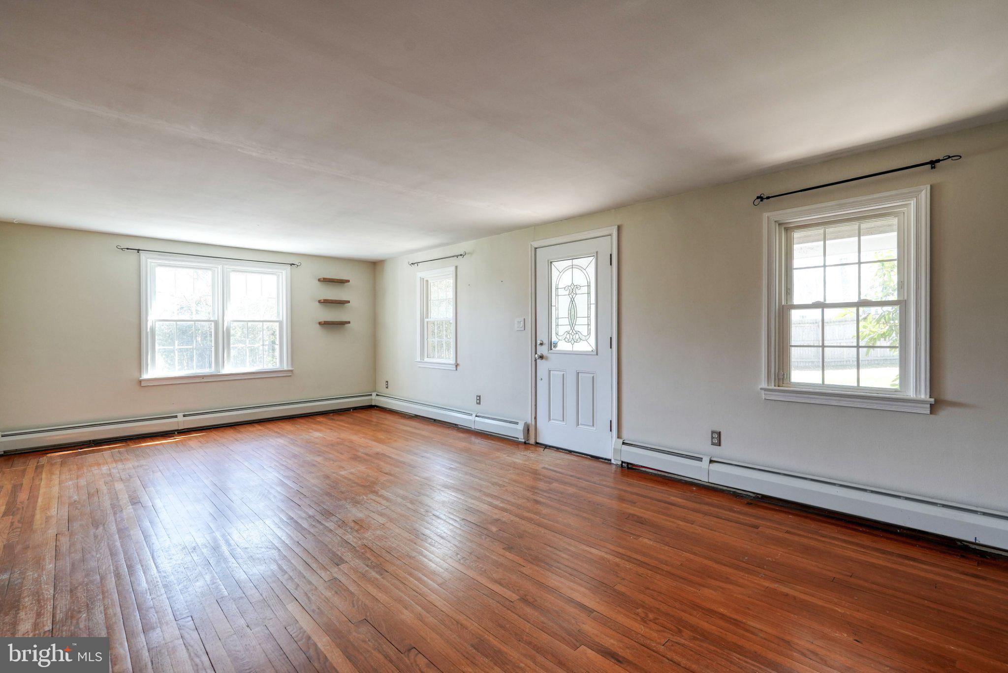 2512 Grandview Road Coatesville, PA 19320 - Photo 31 of 51 an empty room with wooden floor and windows