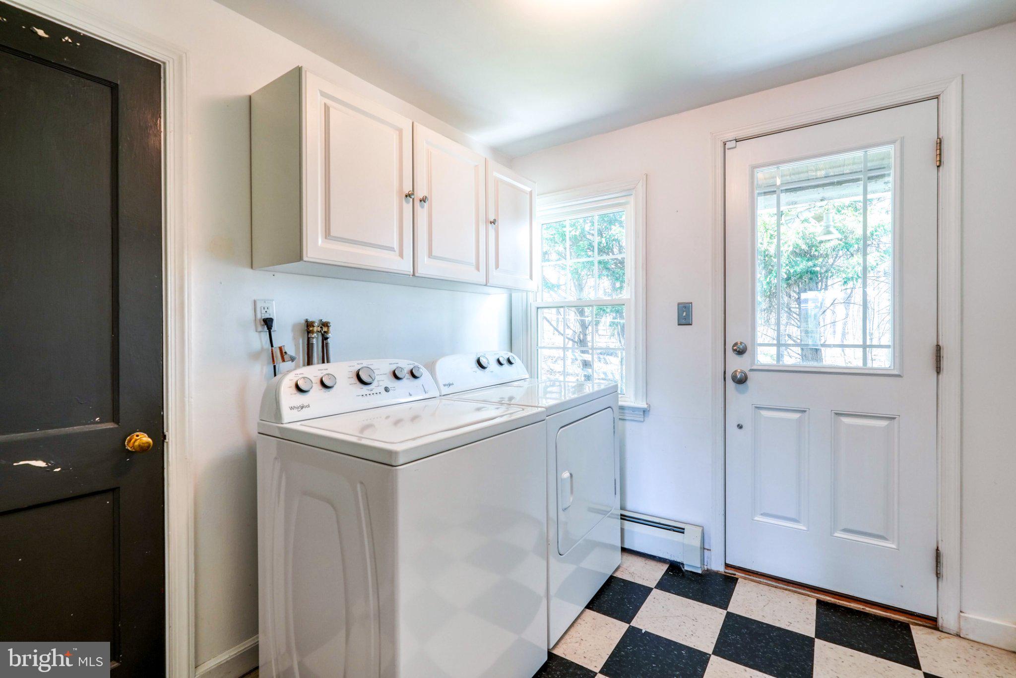 2512 Grandview Road Coatesville, PA 19320 - Photo 32 of 51 a utility room with cabinets washer and dryer