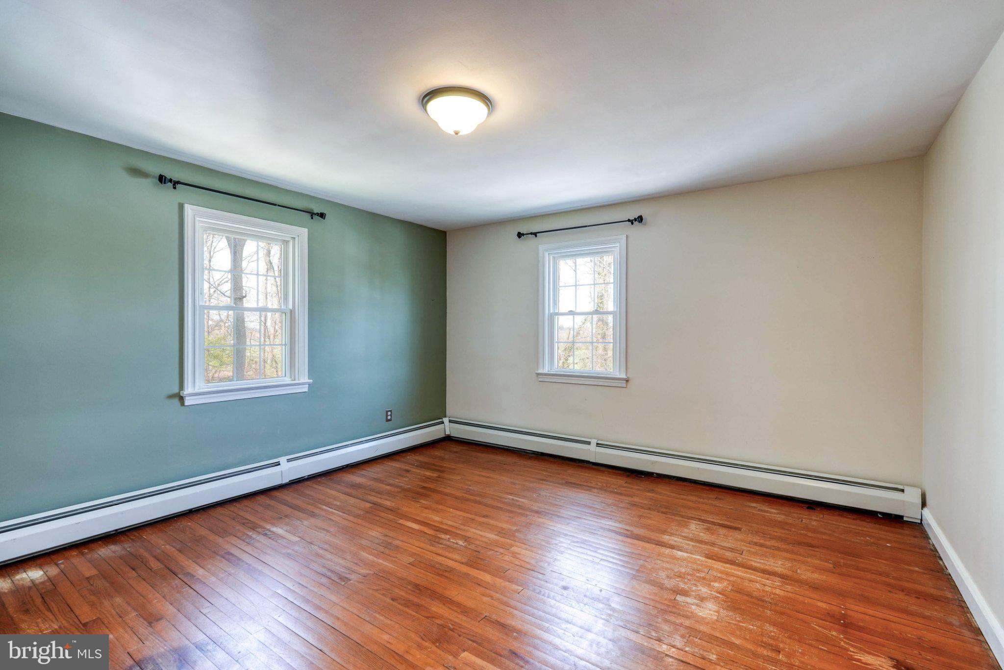 2512 Grandview Road Coatesville, PA 19320 - Photo 38 of 51 an empty room with wooden floor and windows