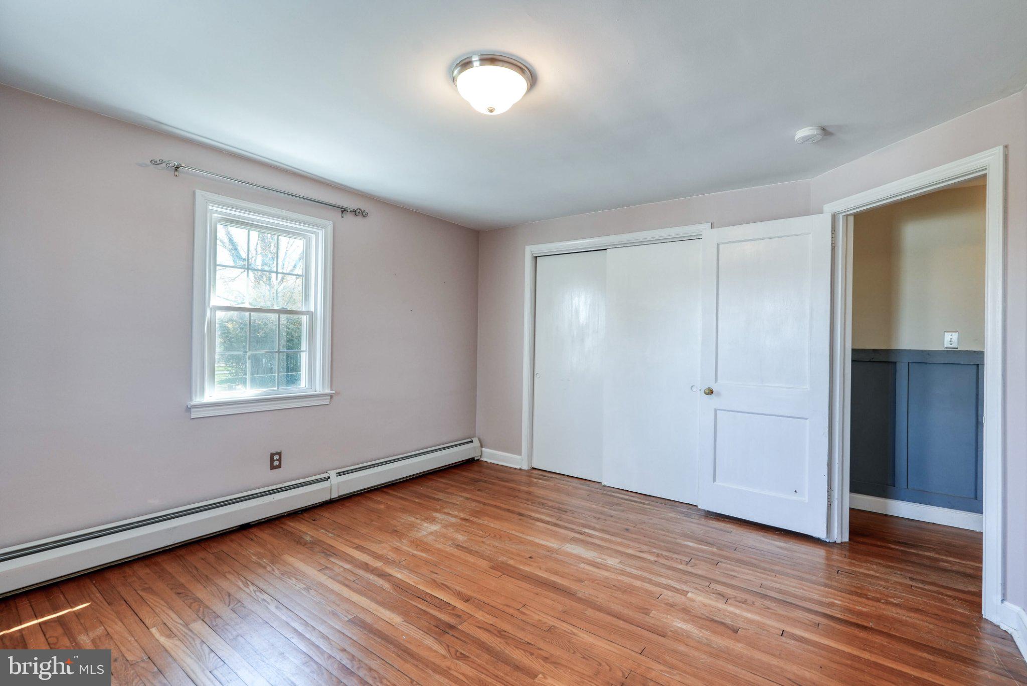 2512 Grandview Road Coatesville, PA 19320 - Photo 42 of 51 a view of an empty room with wooden floor and a window