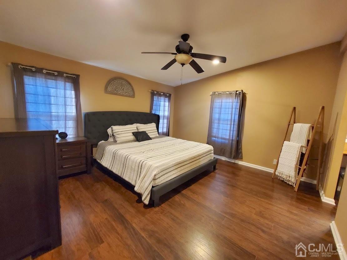 39 Poe Road North Brunswick, NJ 08902 - Photo 8 of 22 a bedroom with a bed and wooden floor