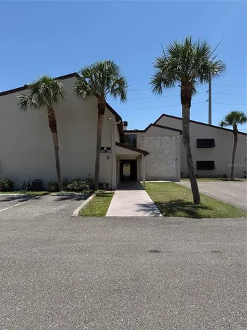 a view of a house with basketball court