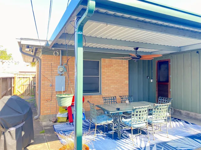 a front view of a house with outdoor seating