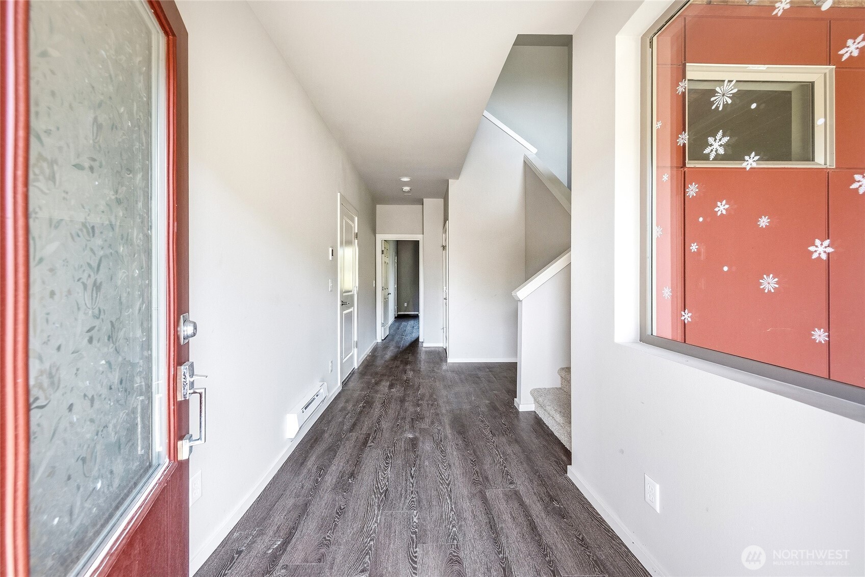 1066 Southwest 99th Place, Unit 55 Seattle, WA 98106 - Photo 5 of 21 a view of a hallway with wooden floor and staircase