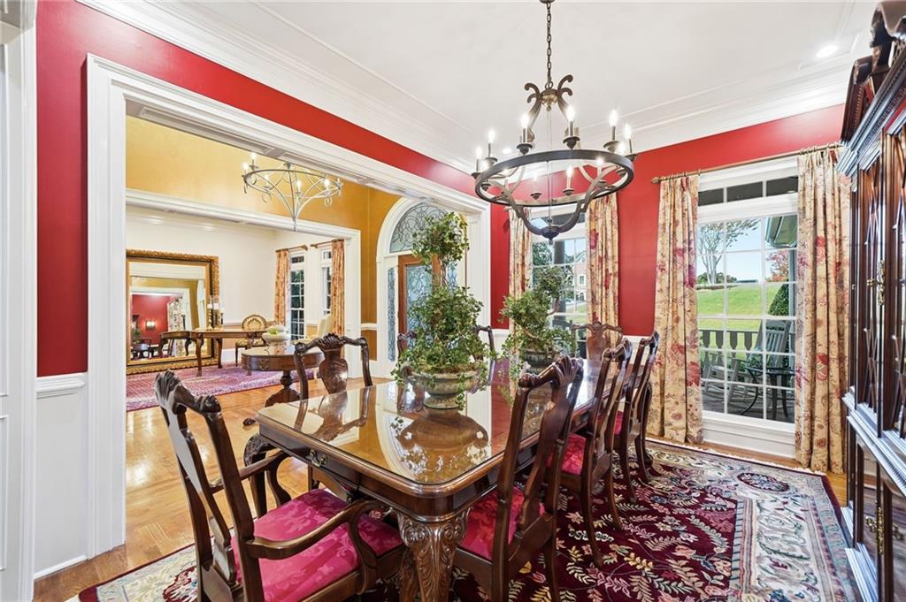 2855 Strathmore Drive Cumming, GA 30041 - Photo 12 of 96 a view of a dining room with furniture wooden floor and chandelier