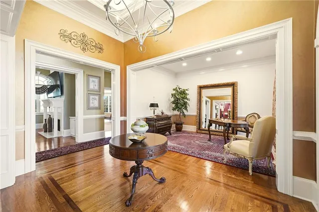 a living room with furniture and floor to ceiling windows