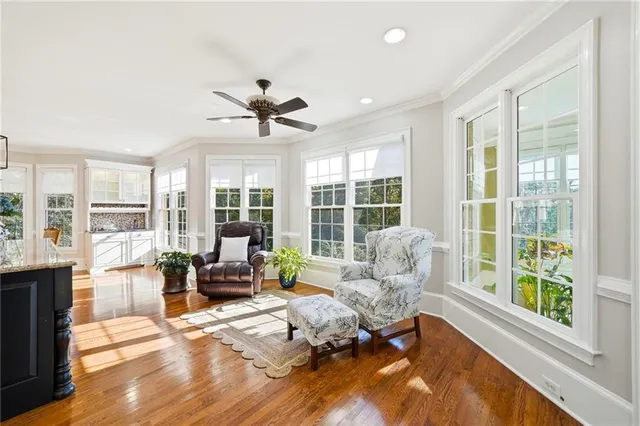 a kitchen with stainless steel appliances granite countertop a stove a sink and a wooden floors