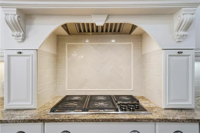 a living room with furniture fireplace and wooden floor