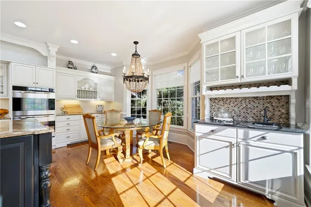 a spacious bedroom with a balcony a bed and a fireplace