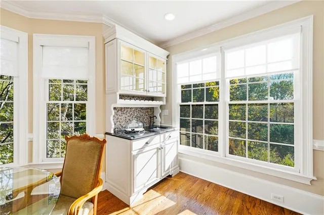 a living room with furniture and a ceiling fan