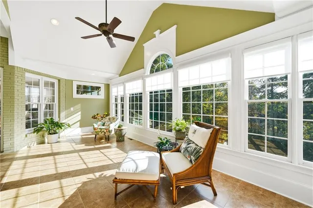 a bathroom with a tub and a painting on the wall